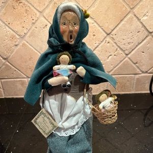 Vintage Buyers Choice Caroler, woman with basket on babies